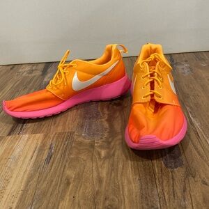Ombré pink and orange Nike running shoes